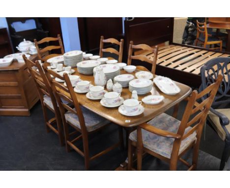An Ercol refectory table and six chairs