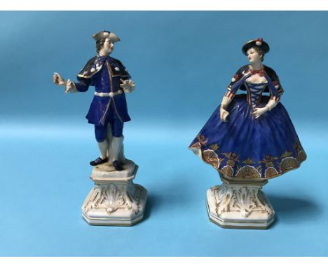 A pair of Continental porcelain figures of a gallant and a lady, blue printed 'R' to base, numbered 1762