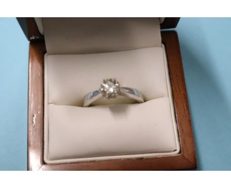 An 18ct white gold solitaire ring, 4.1g, size 'M', 0.8ct
