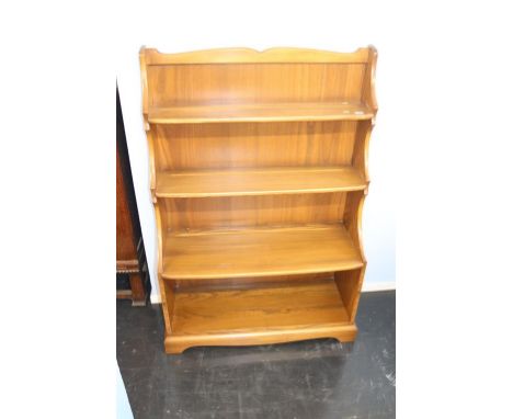 An Ercol waterfall bookcase