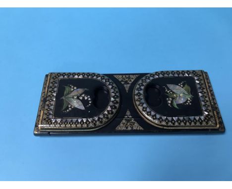 A Victorian mother of pearl and papier mache book stand