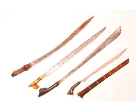Lot of 3 Co Jang swords, including one with Hulu tapa guda grip and a Batak kalasan sword in wooden sheath, Sumatra, Indonesi