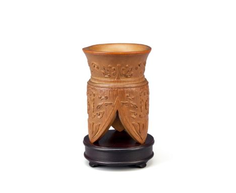 A CHINESE BAMBOO ARCHAISTIC TRIPOD VESSEL QING DYNASTY The tapered body supported on three lappet-shaped legs, all carved wit
