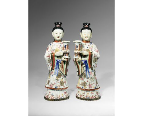 A LARGE PAIR OF CHINESE FAMILLE ROSE MODELS OF COURT LADIES QIANLONG 1736-95 Each depicted standing wearing long robes painte