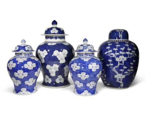 FOUR CHINESE BLUE AND WHITE 'PRUNUS' VASES AND COVERS 19TH CENTURY Three of the vases baluster-shaped, the other of ovoid for