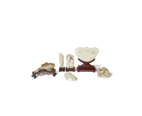 SIX CHINESE JADE CARVINGS QING DYNASTY Comprising: a monkey with its infant, a three-legged toad, a butterfly, a figure with 