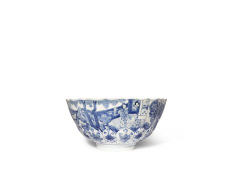 A CHINESE BLUE AND WHITE LOTUS-MOULDED BOWL SIX CHARACTER KANGXI MARK AND OF THE PERIOD 1662-1722 Painted to the exterior wit