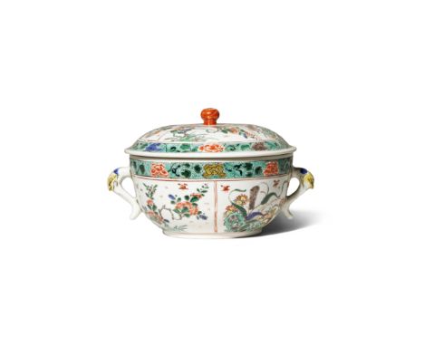 A CHINESE FAMILLE VERTE BOWL AND COVER KANGXI 1662-1722 The compressed circular body and lid decorated with panels of floweri
