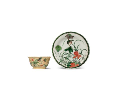 A CHINESE FAMILLE VERTE CAFE-AU-LAIT GROUND TEA BOWL AND SAUCER KANGXI 1662-1722 Each painted in enamels with birds and fish 