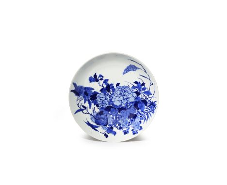 A CHINESE BLUE AND WHITE DISH LATE QING DYNASTY The well decorated with a large bouquet of peonies, chrysanthemum, chestnuts 