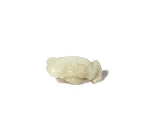 A CHINESE PALE CELADON JADE CARVING OF A THREE-LEGGED TOAD QING DYNASTY OR LATER Lying down with its head slightly raised and