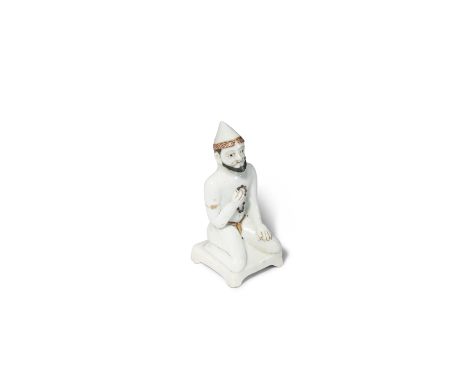 A RARE CHINESE PORCELAIN FIGURE OF A FOREIGNER 18TH/EARLY 19TH CENTURY Possibly depicting a man from Southern Asia, the beard