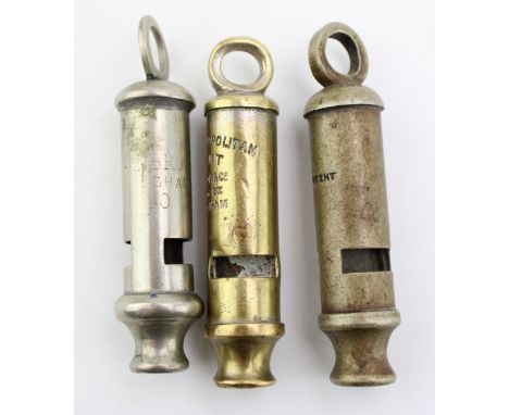 Three c20th metal whistles including a WW2 Adie Bros, Birmingham whistle marked 1940 with a broad arrow, a whistle marked 'pa