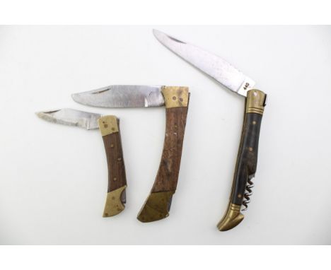 Three folding pocket lock knives including a bone handle pocket knife with corkscrew  good to very good condition with signs 