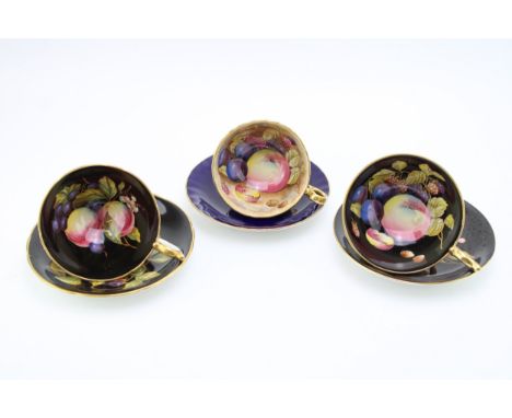 Aynsley Orchard Gold tea cup and saucers, one in cobalt blue and two with black backgrounds (3).  In good condition with no o