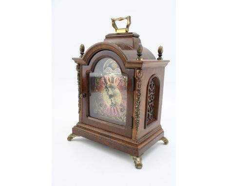 Wuba Warmink mahogany and similar cased mantel clock with metal roman numeral dial, supported on brass feet, 24cm tall, with 