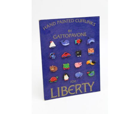 A point of sale advertising shop card for LIBERTY of London, 'Hand Painted Cufflinks' by GATTOPAVONE, on easel back. 18cm x 2