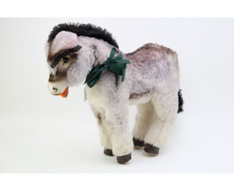 A Steiff Donkey, medium size. Stud to left ear, (ribbon missing). Height 39cm.  In good original condition.