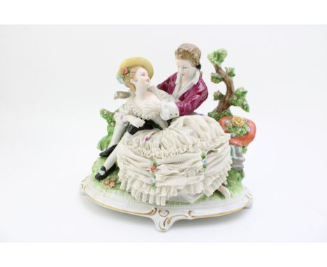 Unterweissbach Dresden Lace figurine group of a romantical scene, gilt highlights, 23cm wide.  In good condition with no obvi