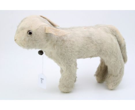 A vintage straw filled stuffed toy lamb 'Reverend', original glass c1930s. Height 25cm.  In good original condition, some lig