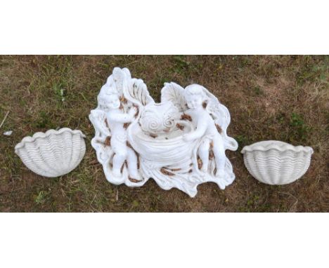 20th century plaster wall hanging planter flanked by two cherubs 74cm wide and two shell form wall hanging planters.    