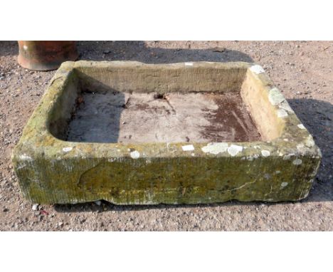 Carved stone trough 70 cm wide.    