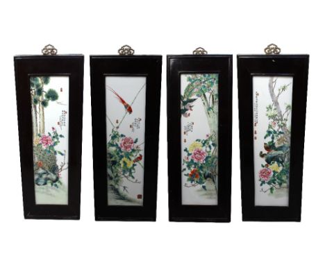 A set of four Chinese Republic period porcelain plaques painted in the Famille Rose palette with scenes of birds among trees 