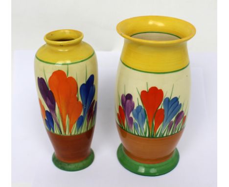 Two Clarice Cliff Bizarre 'Crocus' hand-painted baluster vases, the taller with printed Newport Pottery mark to base, height 