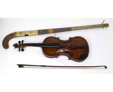 A cased violin for restoration, length 59cm and a bow, also a vintage wooden hockey stick, as used by the Indian Olympic Hock