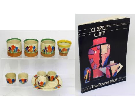A mixed lot of Clarice Cliff 'Crocus' pattern items including three jars (af), egg stand with three egg cups, three other pie