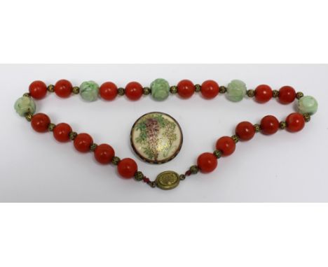 An Oriental coral and jade large bead necklace and a yellow metal Satsuma enamelled floral decorated brooch (2). CONDITION RE