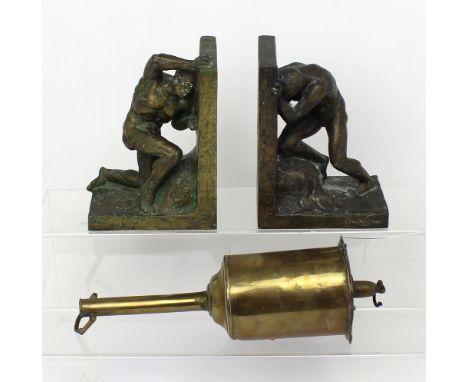 A vintage pair of metal bookends in the form of Atlas holding up the world and a Victorian W.Jones, brass spit turner (3).