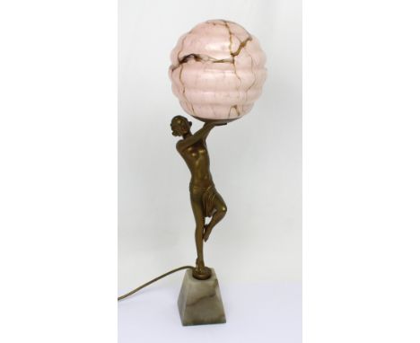 A large Art Deco lamp with mottled pink shade supported by a scantily-clad female, on plinth base, unsigned, height 62cm to t