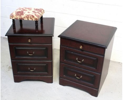 A pair of contemporary Stag-style bedroom cabinets with pull-out shelf over two drawers to curved plinth base and a small foo