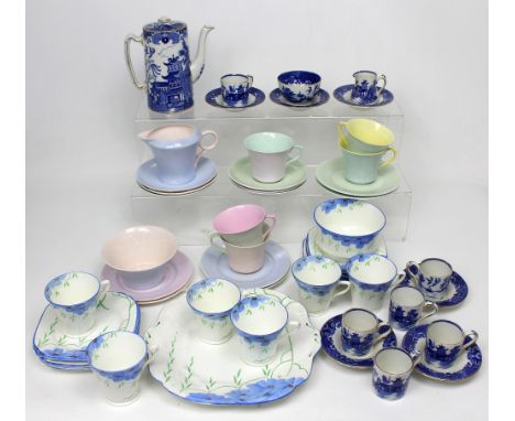 A Shelly Art Deco tea service (lacking one cup), an early blue and white willow pattern coffee services, to include coffee po