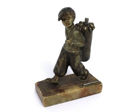 A desk/tabletop match striker modelled as a young male golf caddy on stone base, height 20.5cm. CONDITION REPORT Age-related 