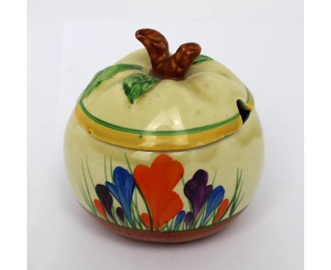 A Clarice Cliff Bizarre 'Crocus' preserve pot, height 8cm. CONDITION REPORT Age-related wear, some pooling of glaze to rim, a