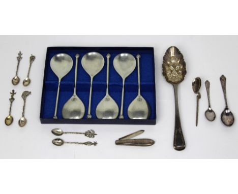 A George III hallmarked silver berry spoon, date marks rubbed, length 22cm, a Victorian hallmarked silver bladed and handled 