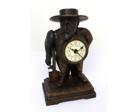 A French automaton clock and match striker/lighter modelled as a bearded gentlemen, the circular dial set with Arabic numeral