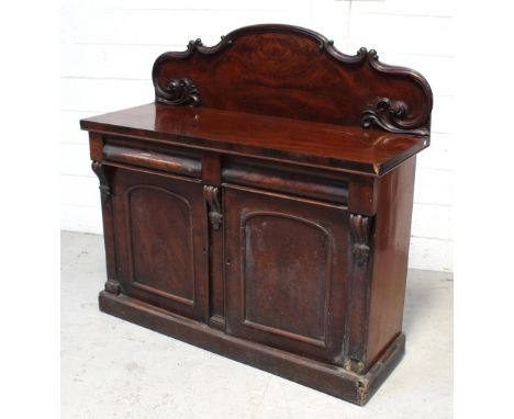 A Victorian mahogany sideboard, curved scrolling back to two bow-front frieze drawers, above two cupboard doors with interior