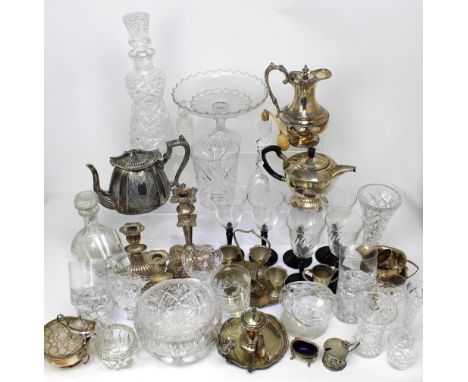 A quantity of glassware and metalware to include decanters, bowls, wine glasses, candlesticks, a part tea service etc.