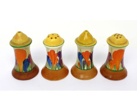 Two pairs of Clarice Cliff salt and pepper pots painted in the 'Crocus' pattern (4). CONDITION REPORT One pair has chips to t