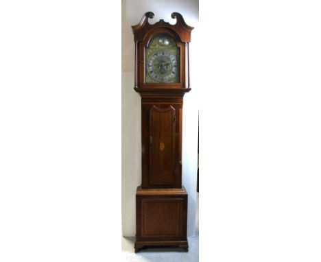 An early 19th century oak, mahogany and satinwood banded longcase clock, the broken swan neck pediment above arched brass dia