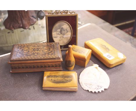 Souvenir ware boxes, an enamel picture frame, a mother of pearl pierced carved Jerusalem panel, etc