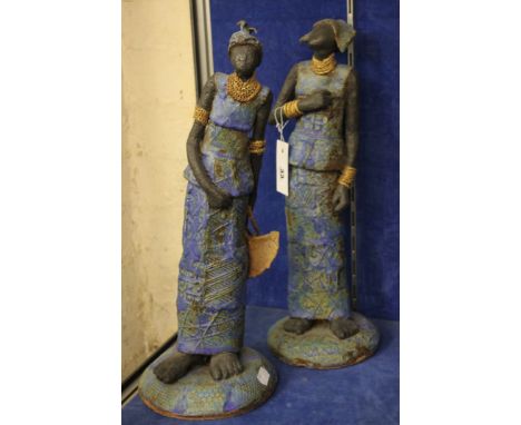 A pair of African women ceramic sculptures, 45cm high approx. 