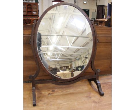 A 19th Century mahogany swing dressing mirror and a 19th Century mahogany Chippendale design chair 