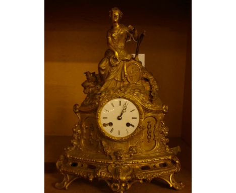An ormolu mantel clock, with classical female figure playing and harp, enamel dial (af), 41cm high