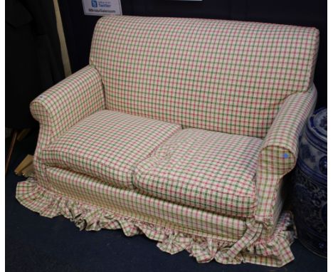 An upholstered sofa in check upholstery 