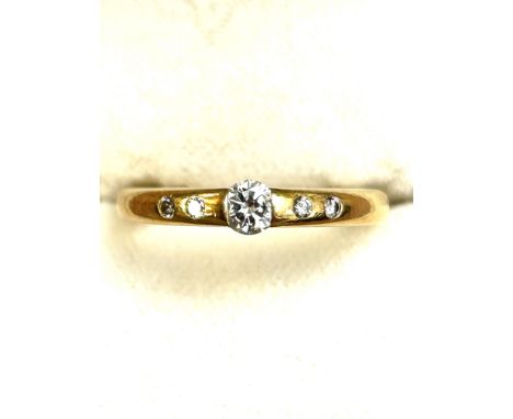 18ct Gold engagement ring with good quality central diamond flanked by 4 smaller diamonds Size K 