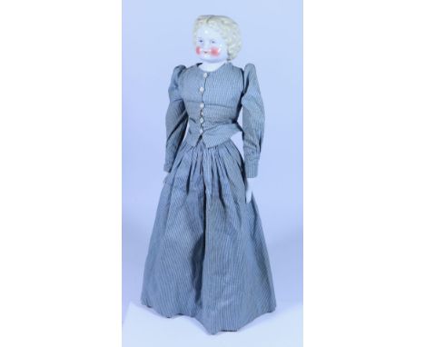 *A glazed china shoulder head doll, German circa 1860, with painted blue eyes, red lines for lids, single stroke brows and mo